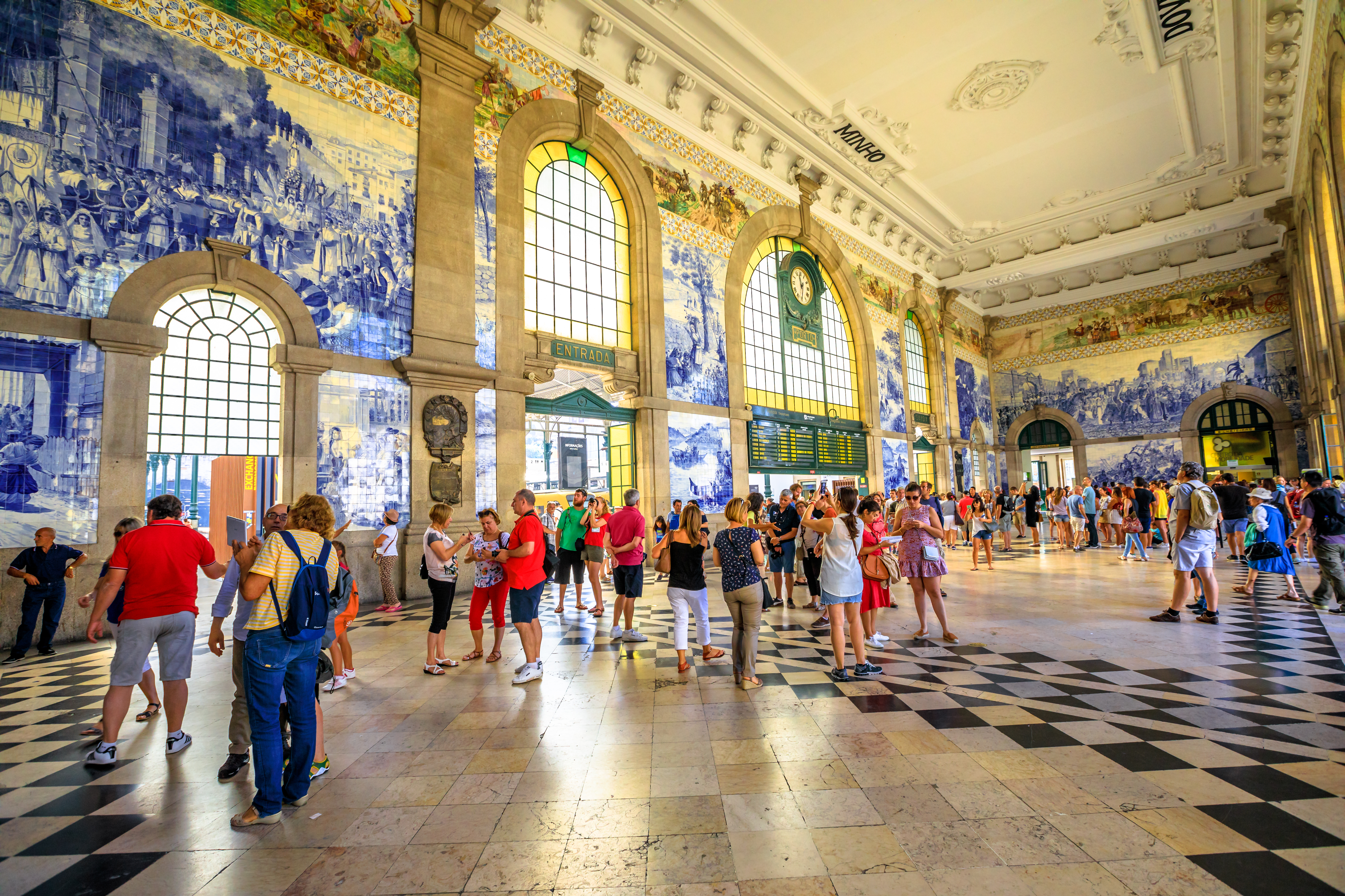 Travelers in a train station in Portugal 