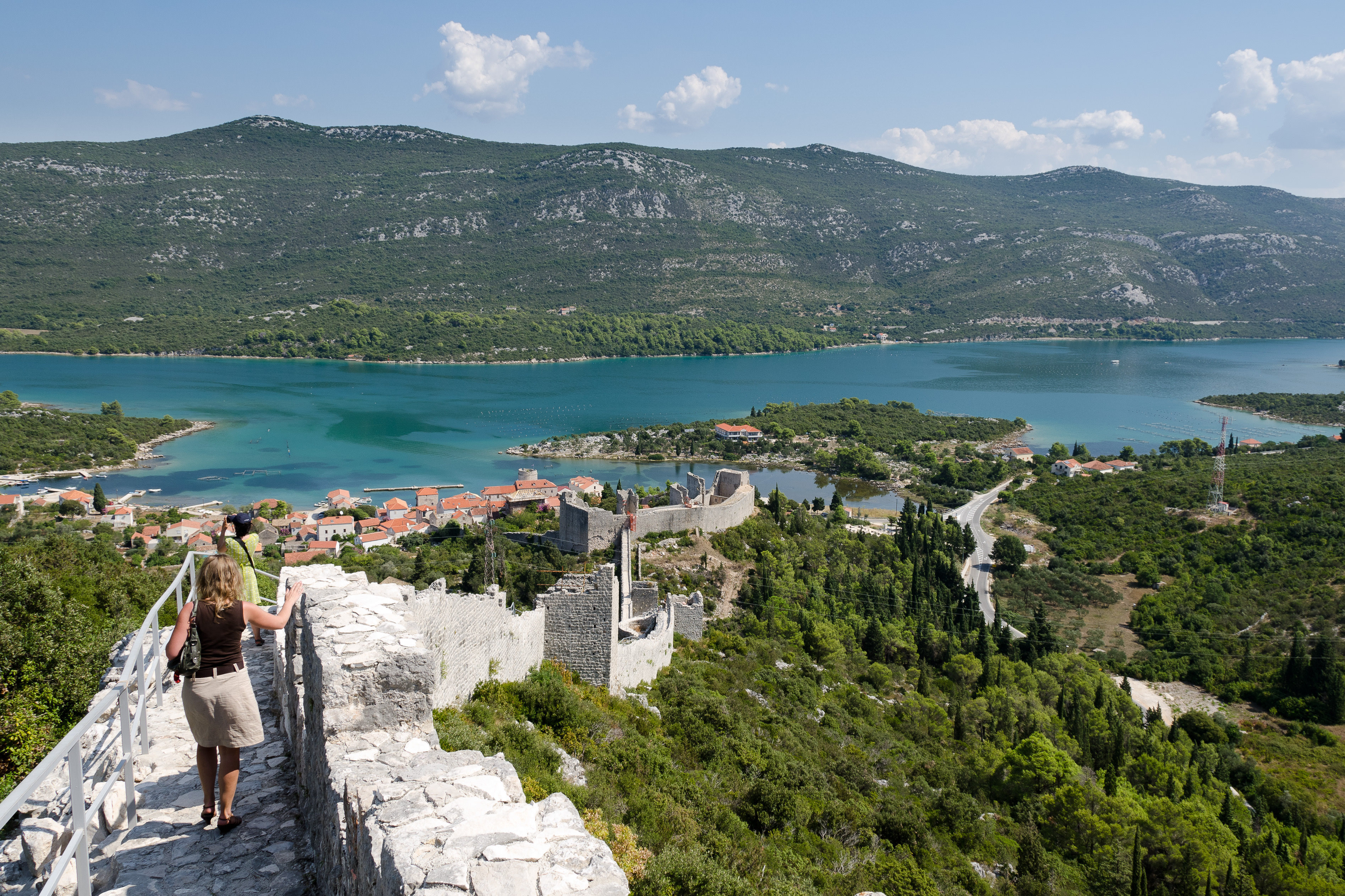 People walking along the defence wall in Ston in Croatia 