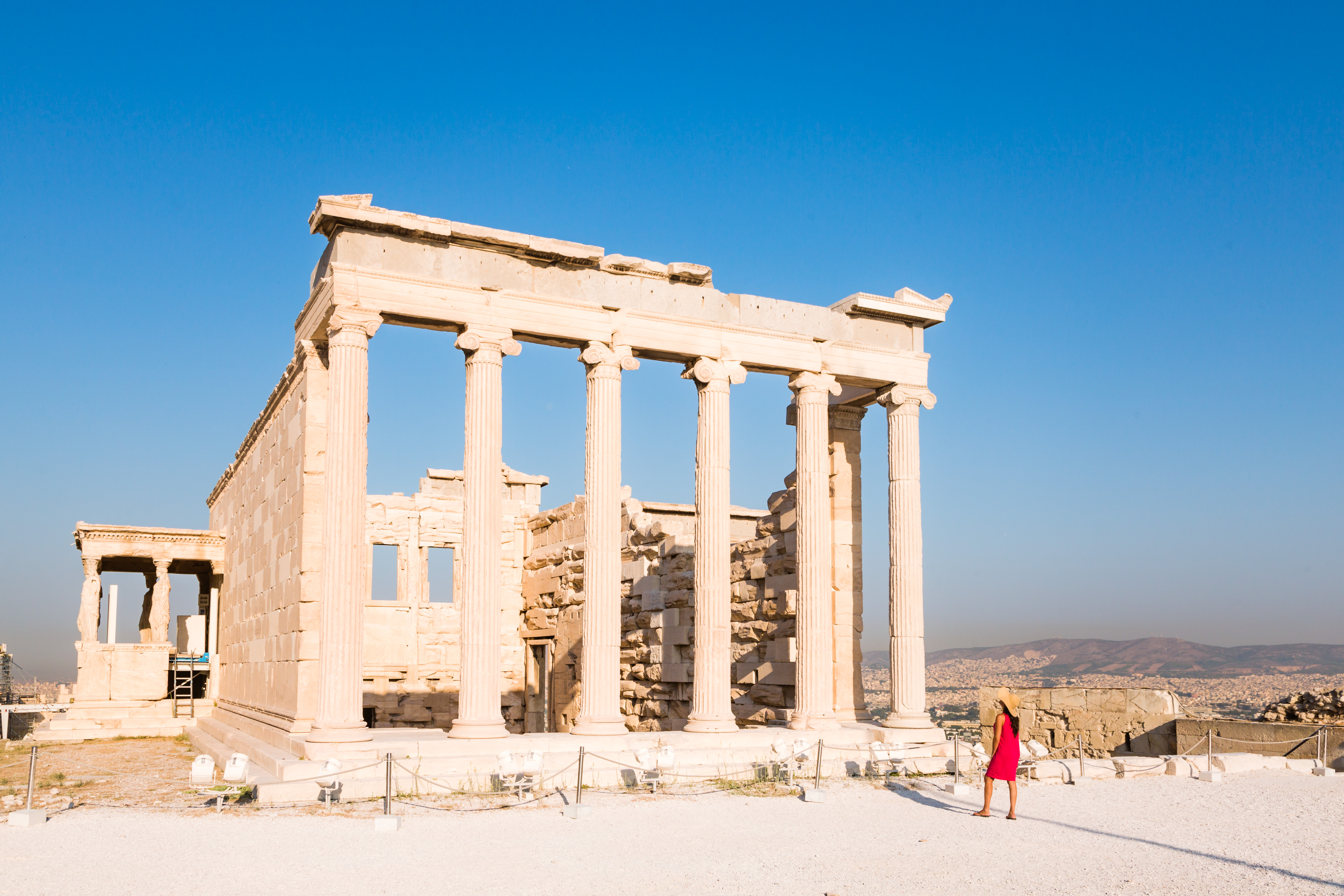 The Acropolis, Athens, Greece Woman looking at a temple on the Acropolis, Athens, Greece.