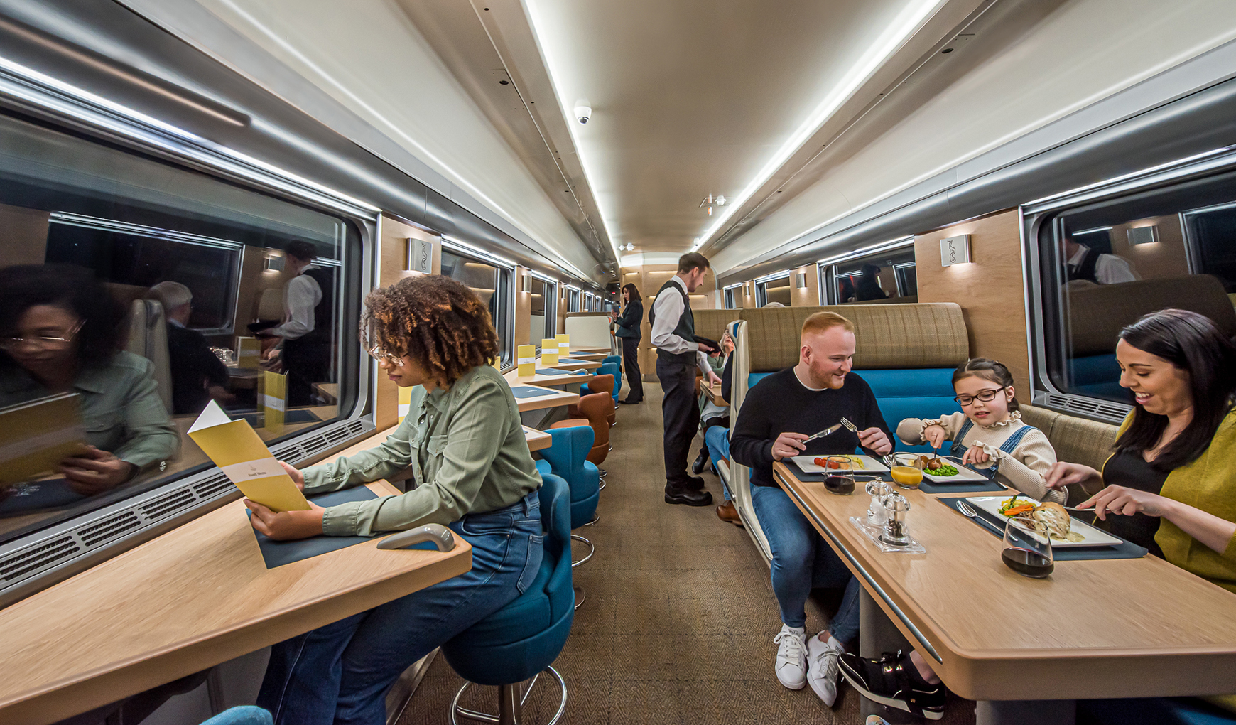 The Club Car on the Caledonian Sleeper train Passengers eat at tables in the Club Car aboard the Caledonian Sleeper overnight train between London and Scotland