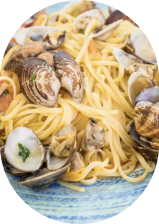 Linguine and clams on a blue plate