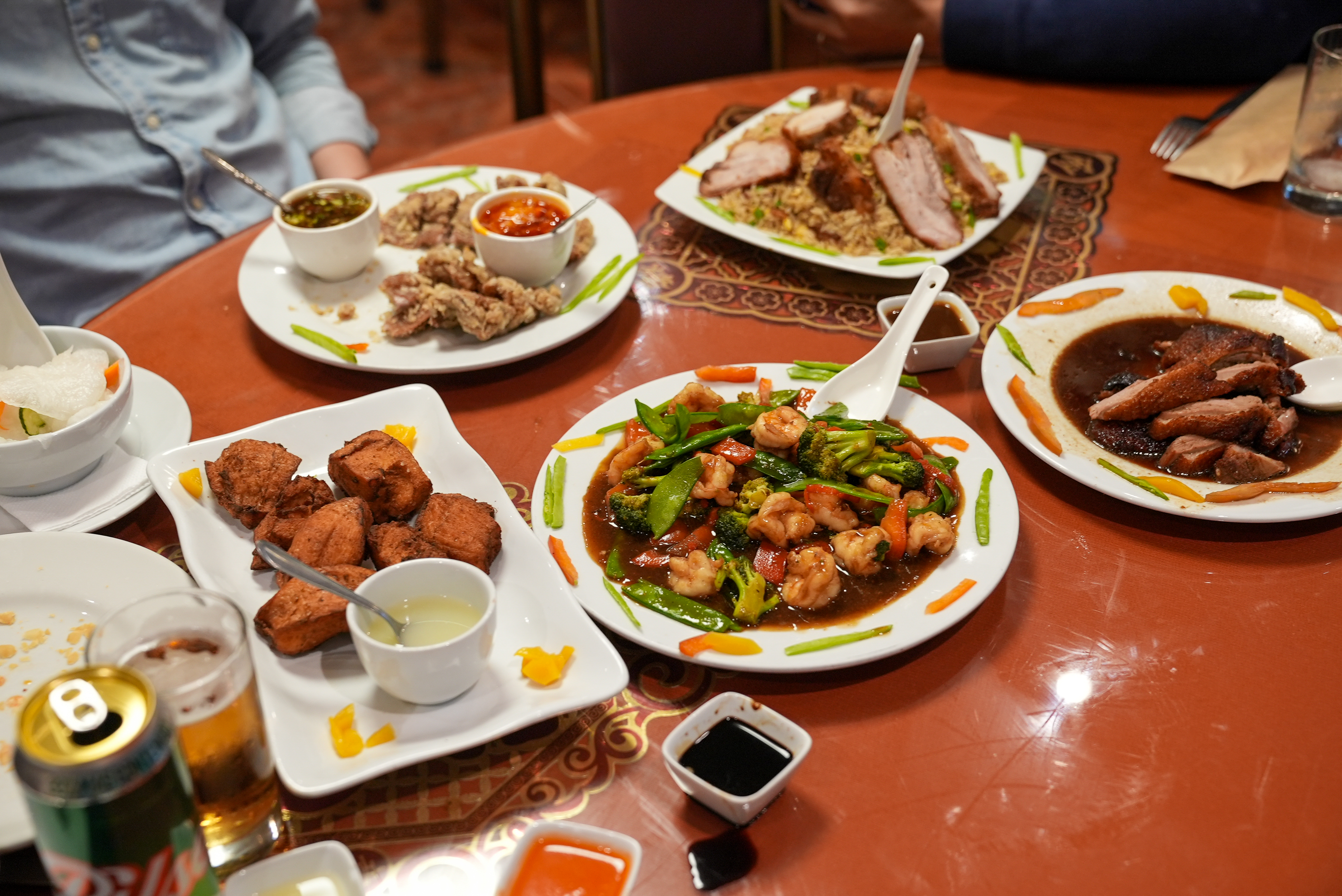 A table full of chifa (Chinese-Peruvian fusion) food on a table in Lima. 